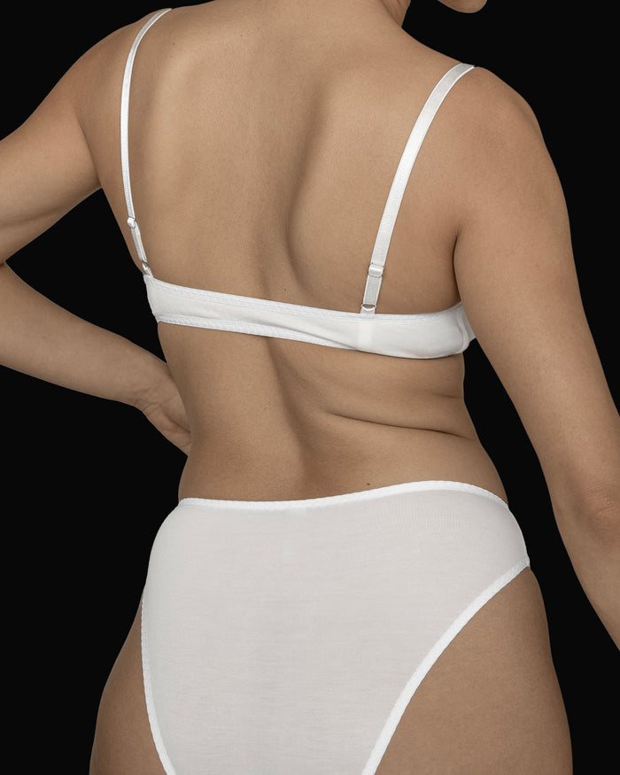 Back view of the Kye Recline Bra bamboo pull-over scoop neck bra/bralette in white. The supportive band and adjustable straps ensure a perfect fit, showcasing the high-quality craftsmanship of Kye Intimates.