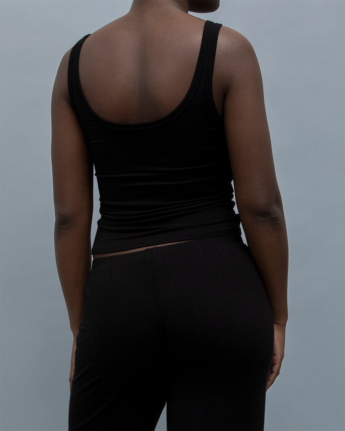 Back view of the Kye Recline Tank in black, showcasing its bamboo fabric and sleek scoop neck design. Kye Intimates’ sleeveless essential.