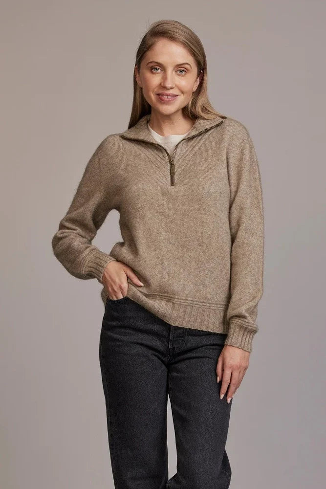Possum and Merino  5040 Ridge Funnel Neck – A beautiful sweater made from the ultimate combination of natural fibres for warmth without weight.  Featuring ridge patter neck detailing and ¼ zip for ease of wear.  ¼ zip and high collar Feature rib knit on neck Mid-weight warmth 35% Possum Fur, 55% Merino Wool, 10% Pure Mulberry Silk New Zealand designed and manufactured