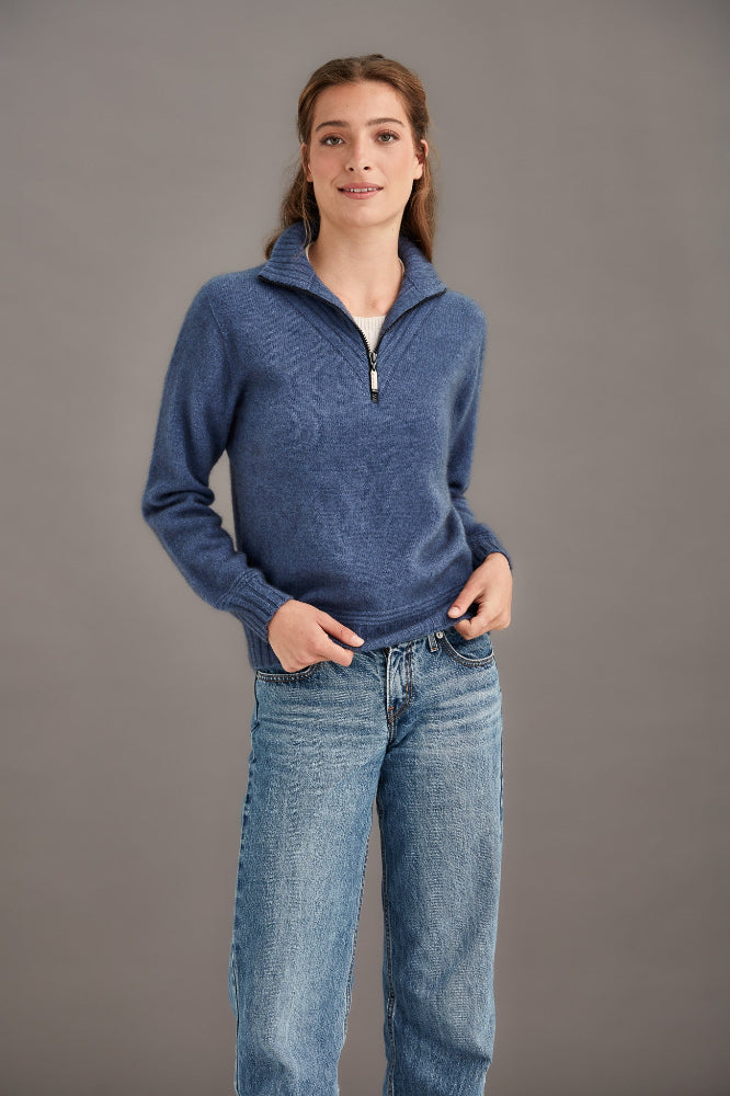 Possum and Merino  5040 Ridge Funnel Neck – A beautiful sweater made from the ultimate combination of natural fibres for warmth without weight.  Featuring ridge patter neck detailing and ¼ zip for ease of wear.  ¼ zip and high collar Feature rib knit on neck Mid-weight warmth 35% Possum Fur, 55% Merino Wool, 10% Pure Mulberry Silk New Zealand designed and manufactured