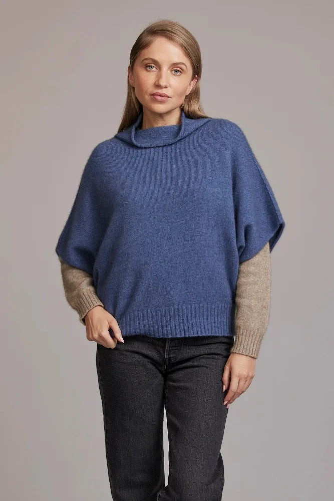 Possum and Merino  5043 Shrug Sweater – This Shrug Sweater impresses with its form and function, artfully draping on the body while keeping you exceptionally warm.  Natural wool and possum fibres combine with delicate mulberry silk to create a forever knit you will cherish for years to come.  Shrug style short sleeve sweater Lightweight warmth 35% Possum Fur, 55% Merino Wool, 10% Pure Mulberry Silk New Zealand designed and manufactured