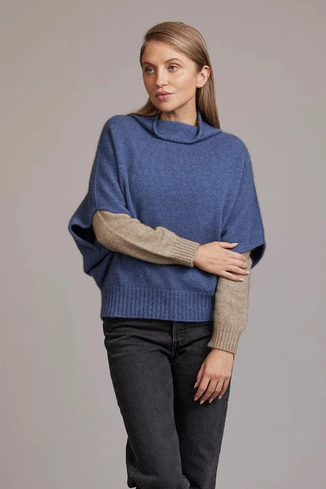 Possum and Merino  5043 Shrug Sweater – This Shrug Sweater impresses with its form and function, artfully draping on the body while keeping you exceptionally warm.  Natural wool and possum fibres combine with delicate mulberry silk to create a forever knit you will cherish for years to come.  Shrug style short sleeve sweater Lightweight warmth 35% Possum Fur, 55% Merino Wool, 10% Pure Mulberry Silk New Zealand designed and manufactured