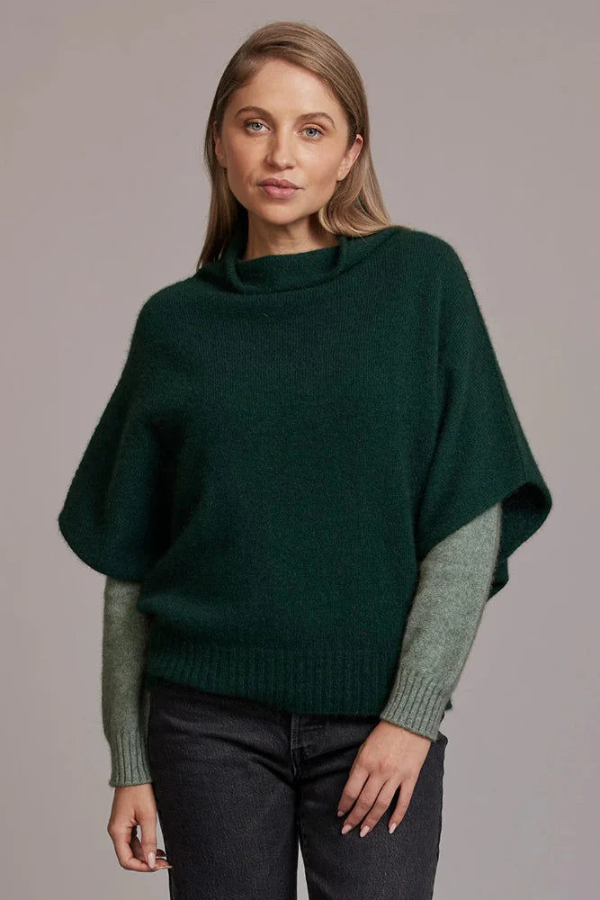 Possum and Merino  5043 Shrug Sweater – This Shrug Sweater impresses with its form and function, artfully draping on the body while keeping you exceptionally warm.  Natural wool and possum fibres combine with delicate mulberry silk to create a forever knit you will cherish for years to come.  Shrug style short sleeve sweater Lightweight warmth 35% Possum Fur, 55% Merino Wool, 10% Pure Mulberry Silk New Zealand designed and manufactured