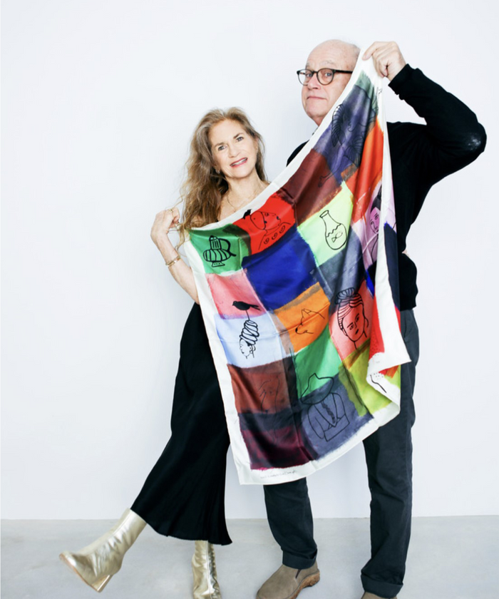 Amy & John Wickersham holding their scarf design