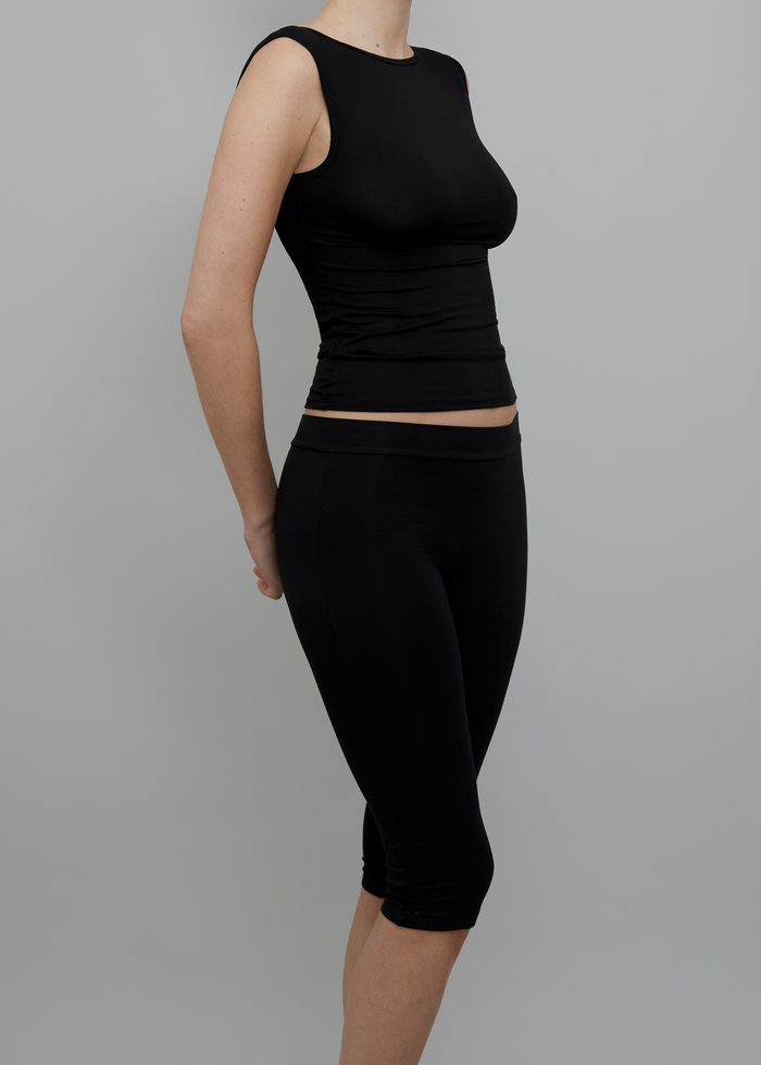 Side View of Recline Bateau Sleeveless Top in Black from KYE Intimates in Los Angeles.