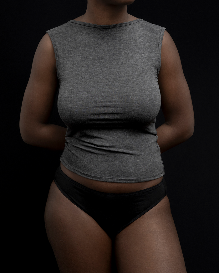 Front view of a model wearing Kye Recline bateau sleeveless in heathered charcoal. The breathable bamboo fabric provides comfort and style, perfect for everyday wear by Kye Intimates.