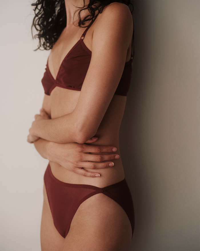 Side View of Daily Triangle Bra in Burgundy for AMO Denim.