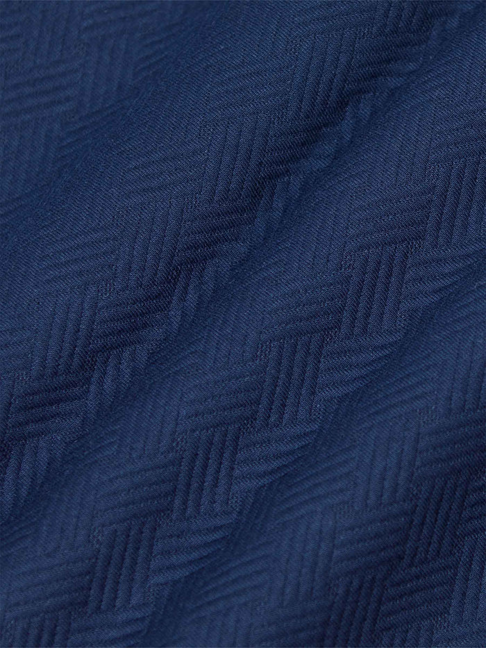 Close-up of textured navy Moorland Sweater fabric. – Wam Denim.