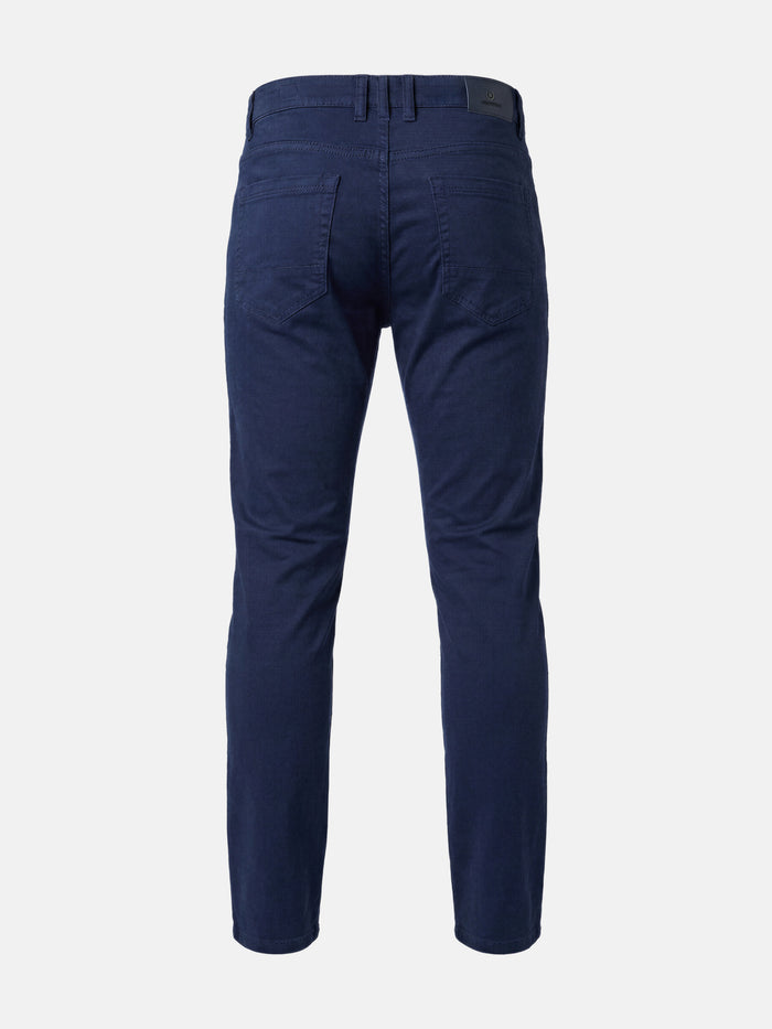 Back view of men’s navy slim-fit jeans with clean stitching and classic pockets