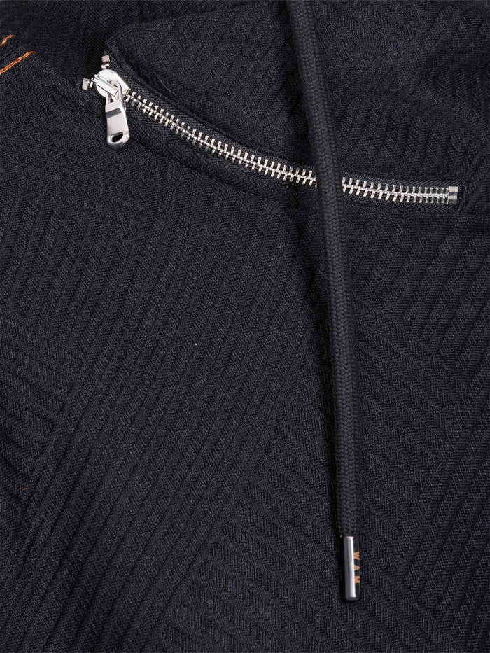 Zipper and drawstring close-up on ribbed black sweater fabric – Wam Denim.