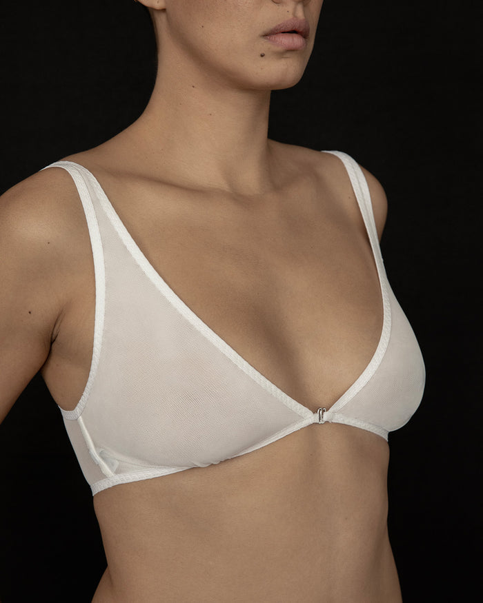 Side view of Kye Dive Bra in Bone, featuring  mesh front closure. Sheer minimalist lingerie.