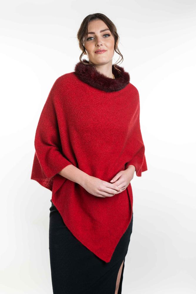 Possum and Merino   KO523 Fur Trim Poncho - A moss stitch poncho trimmed with luxurious possum fur.  This versatile garment can be worn 5 different way   Made proudly in New Zealand from a premium blend of 40% possum fur, 50% merino lambswool & 10% mulberry silk.