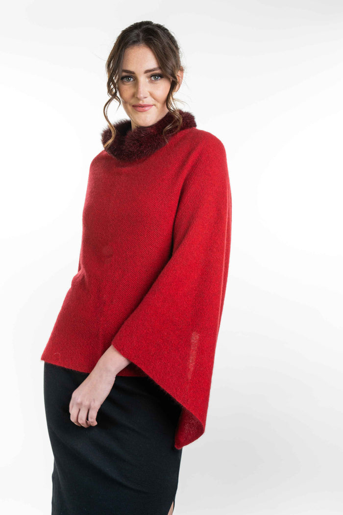 Possum and Merino   KO523 Fur Trim Poncho - A moss stitch poncho trimmed with luxurious possum fur.  This versatile garment can be worn 5 different way   Made proudly in New Zealand from a premium blend of 40% possum fur, 50% merino lambswool & 10% mulberry silk.