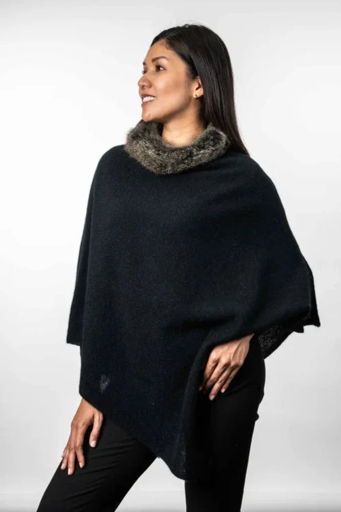 Possum and Merino   KO523 Fur Trim Poncho - A moss stitch poncho trimmed with luxurious possum fur.  This versatile garment can be worn 5 different way   Made proudly in New Zealand from a premium blend of 40% possum fur, 50% merino lambswool & 10% mulberry silk.
