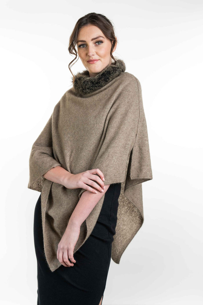 Possum and Merino   KO523 Fur Trim Poncho - A moss stitch poncho trimmed with luxurious possum fur.  This versatile garment can be worn 5 different way   Made proudly in New Zealand from a premium blend of 40% possum fur, 50% merino lambswool & 10% mulberry silk.