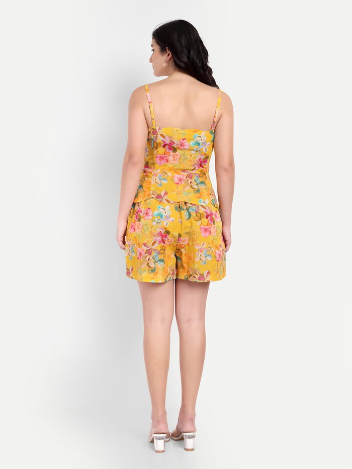 Women’s yellow floral Leo top CB with sleeveless design, relaxed fit and stylish summer look