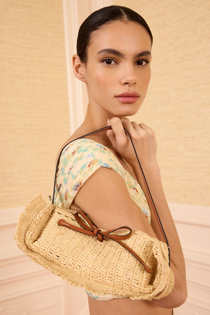 Model Wearing Natural Designer Raffia Scallop Pouchette on Shoulder - Side Profile | Ulla Johnson