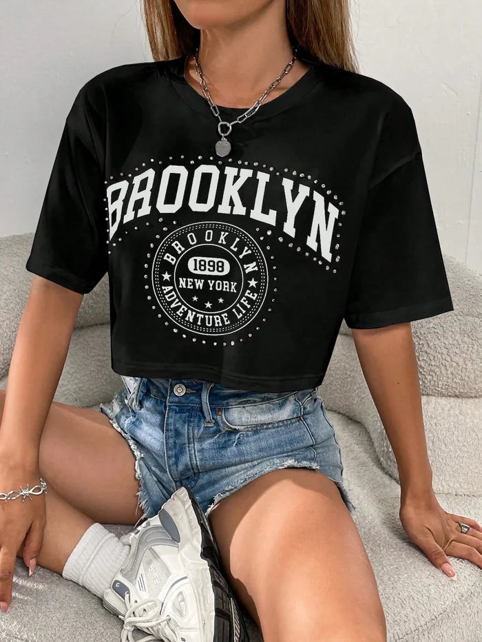 SXV Brooklyn Letter Graphic Drop Shoulder Tee Graphic Tees Women Tops